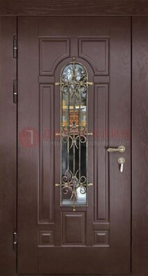 Темная железная дверь со стеклом и ковкой для частного дома ДСК-156 в Лыткарино