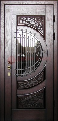 Одностворчатая входная дверь со стеклом и ковкой ДСК-21 в Можайске